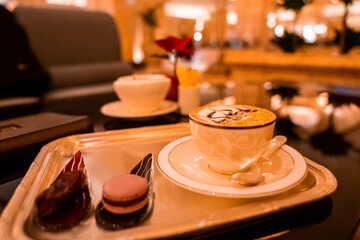 Cup of Golden Cappuccino in Abu Dhabi. Coffee with gold decoration. UAE. United Arab Emirates.