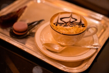 Cup of Golden Cappuccino in Abu Dhabi. Coffee with gold decoration. UAE. United Arab Emirates. © Aerial Film Studio