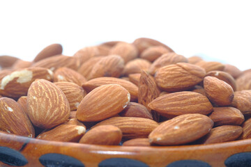 Close up of almond nut isolated on white 