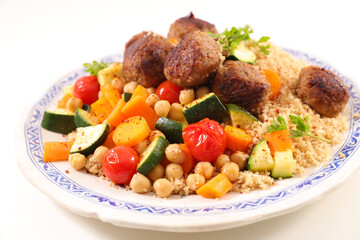 couscous with vegetables and meatballs in plate