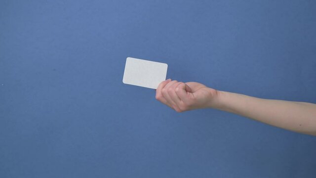 Woman hand hold business card, credit card or blank paper isolated