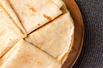 Traditional Russian Crepes Blini . Thin pancakes on a plate. Top view