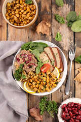 vegan salad bowl with tofu, chickpea, bean and spinach