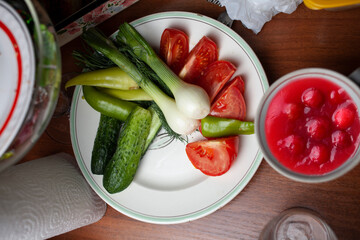 Rural lunch of cucumbers, onions and tomato