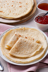 Traditional Russian Crepes Blini. Homemade thin pancakes. .Accompanied by jam and honey