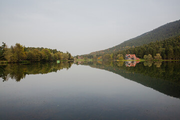 Beautiful landscape in spring with mountains and trees reflecting on a calm lake like a mirror, Reflection on Abant Lake TURKEY