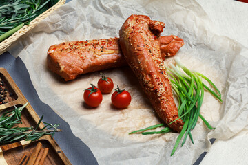  Large piece of turkey filet smoked in the traditional way, on paper, with fresh herbs, cherry...