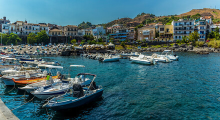Fototapeta na wymiar The harbour and promenade of Acicastello, Sicily in summer