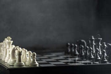 black and white chess on a chessboard. International Chess Day