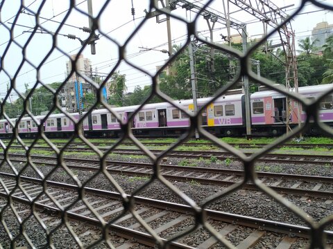 Mumbai, Maharashtra/India- June 30 2020:  People commuting on the public transport while maintaining social distancing.