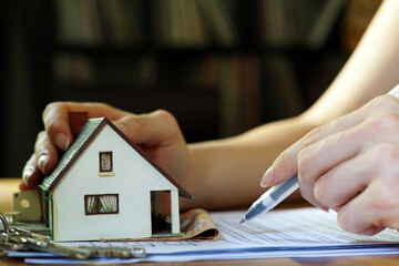 A person signing a mortgage contract