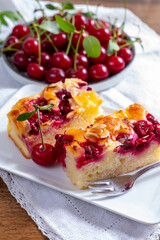 Fresh baked cake with red ripe juicy sour cherry or kriek berry