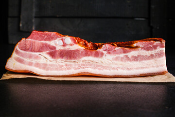 Fototapeta na wymiar smoked bacon piece of meat and fat Menu concept serving size. food background top view copy space for text organic healthy eating raw
