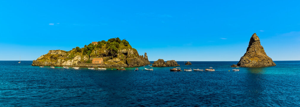 Panorama view of  the Isole dei Ciclopi at Aci Trezza, Sicily in summer