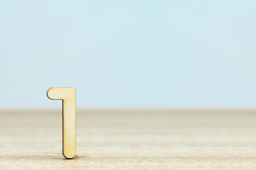 Wooden numeric on table , number one