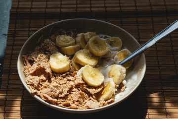 Bowl with cereals and banana slices