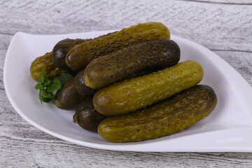 Pickled cucumbers heap in the bowl