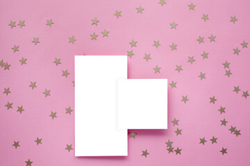 Empty card and gold confetti on pink background. Mockup template. top view. Blank flyer