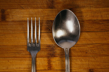 fork and spoon on wooden table