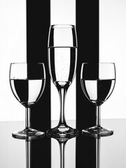 Wine glasses on black and white background.