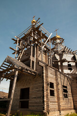 Fototapeta na wymiar unfinished wooden Church on a Sunny clear summer day