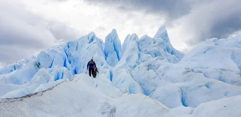 Selbstklebende Fototapeten Gletscher Two climbers near the top of Perito Moreno glacier in Argentina   © Josh
