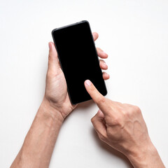 Mockup of hands holding mobile phone with isolated blank black screen on gray background