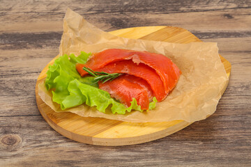 Sliced salmon fillet served rosemary