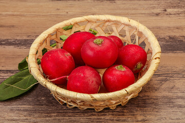 Ripe fresh radish heap over wooden