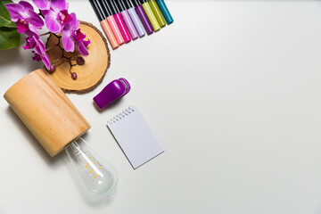 Art supplies on a white desk shot from high angle. Creative workplace concept