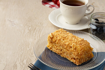 Small piece of russian honey cake on glass plate