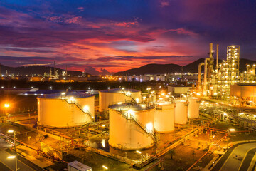 Aerial view Oil refinery.Industrial view at oil refinery plant form industry zone with sunrise and cloudy sky.Oil refinery and Petrochemical plant at dusk Thailand. Oil refinery background.