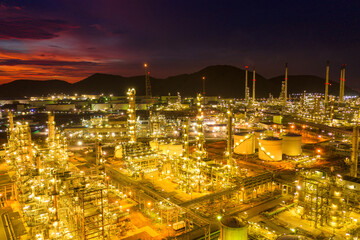 Aerial view Oil refinery.Industrial view at oil refinery plant form industry zone with sunrise and cloudy sky.Oil refinery and Petrochemical plant at dusk Thailand. Oil refinery background.