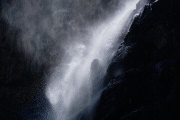 water falling at high speed in a ray of light