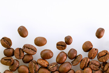 Closeup of coffee beans on white  background .  Background or texture concept.