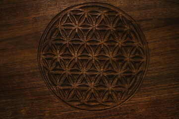 wooden flower of life sign texture background