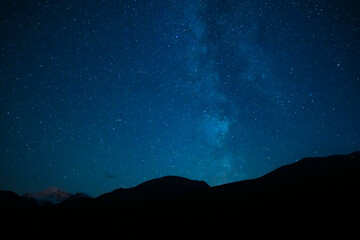 Mountain Silhouette Under Summer Stars Night Sky - obrazy, fototapety, plakaty