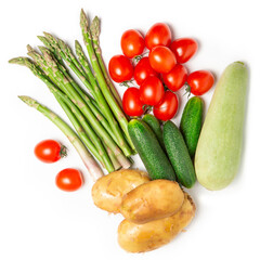 Naklejka na ściany i meble Fresh vegetables on a white isolated background. Crops. Asparagus, tomatoes, zucchini. Flat lay. The concept of proper nutrition.