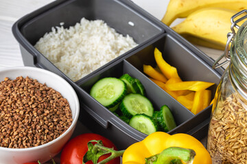 Close up photo of plastic lunch box with cooked food