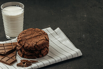 Chocolate cookies on dark table close up