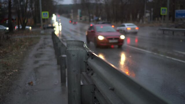 City traffic on wet road during rainy day. Bypass road in the city of Simferopol.