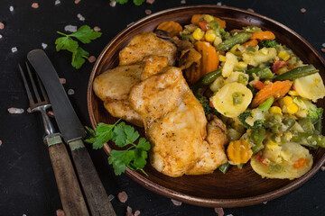 Fried chicken fillet with vegetables.