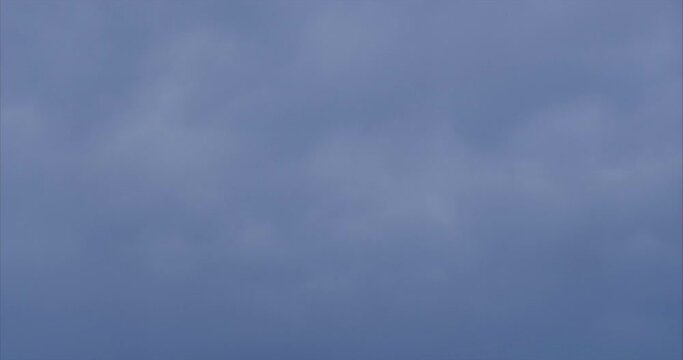CLOUDS FLOAT BY ON A CLOUDY, RAINY DAY
