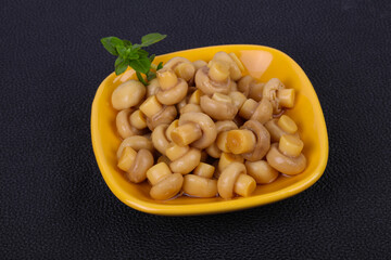 Pickled champignon heap in the bowl