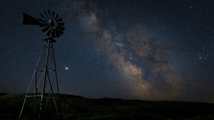 starry night sky with windmill