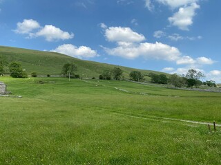 Fototapeta premium Extensive landscape view, of fields and hills, in the Yorkshire dales.