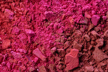 Background of smashed pink blush cosmetic powder