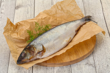 Salted herring over the wooden board