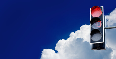 image of a traffic light on a city road against the sky