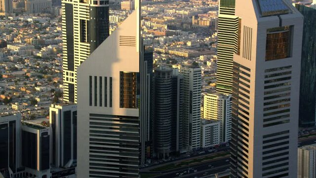 Aerial shot of Jumeirah Emirates Towers zooming out revealing the view of Financial District and Shaik Zayed road and zooming in and out of Dubai skyline 6-axis stabilized gimbal, Shotover F1, 8K,